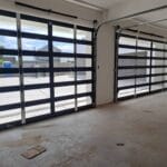 Two aluminium framed glass garage doors interior view