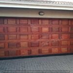 Meranti 40 panel sectional garage door installed in residential driveway