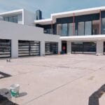 Multiple aluminium framed glass garage doors exterior installation