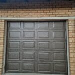 Aluzinc bronze single garage door with block panel design exterior