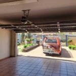Interior view of bronze narrow fluted aluminium double garage door with automation system