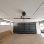 Interior view of aluminium cladded garage doors with motorised track system
