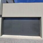 Frameless aluminium cladded garage door with sleek modern finish