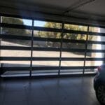 Frameless glass aluminium garage door inside garage view