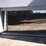 Frameless glass aluminium garage door exterior modern home