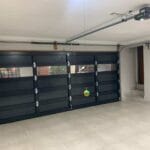 Standard cladded double garage door with glass inserts interior
