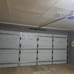 White aluzinc double garage door interior with block pattern and motor system